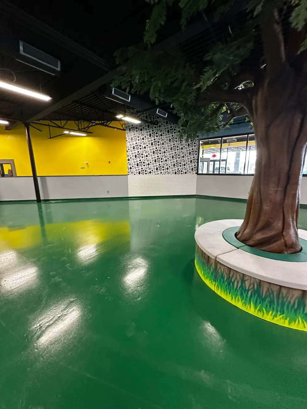 Recreation facility with green floor and yellow walls